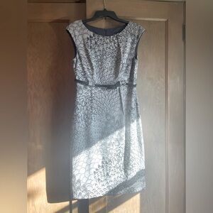 Brand New dress in black and white pattern. Black belt, slight cap sleeve.